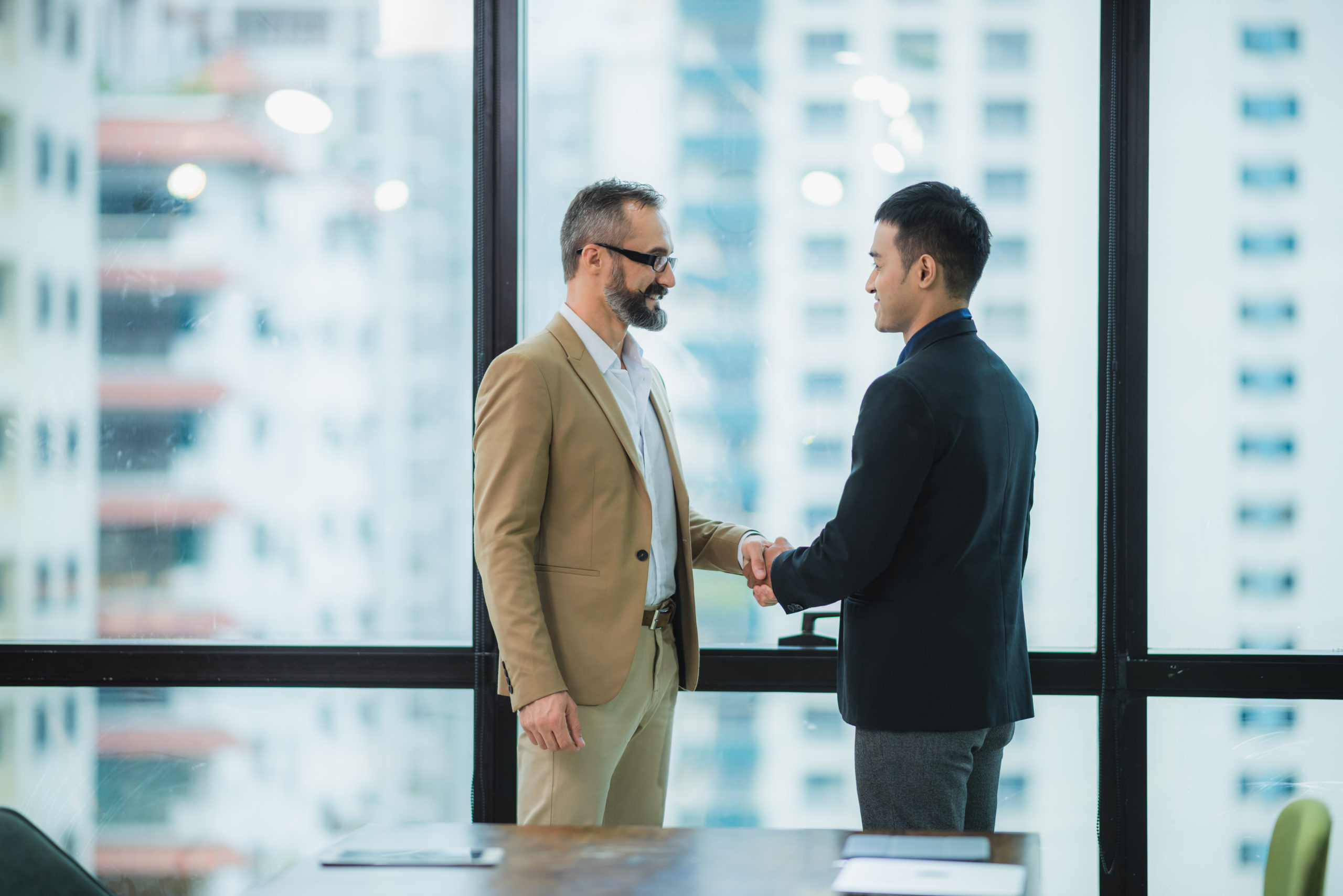 Two businessmen shake hands